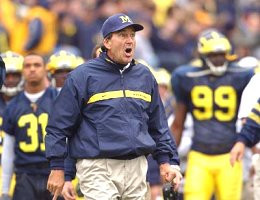 Lloyd Carr, Zia Combs (31) ,and Pierre Woods (99)