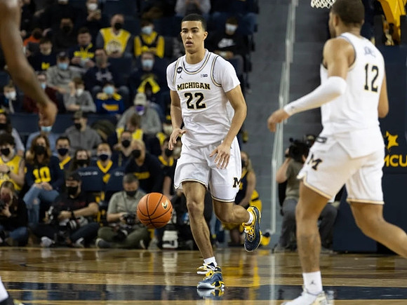 Caleb Houstan (22) and DeVante' Jones (12)