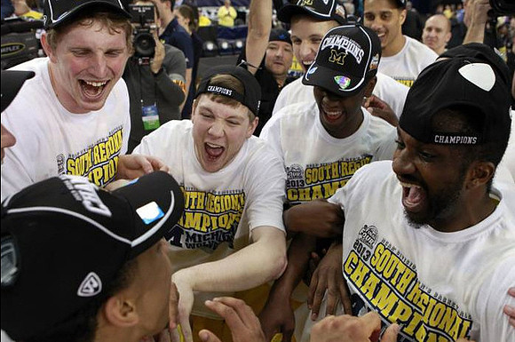 Trey Burke (3), Blake McLimans (22), Matt Vogrich (13), Caris LeVert (23), Max Bielfeldt (44), Jordan Morgan (52), and Corey Person (32)