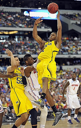 John Beilein, Tim Hardaway Jr. (10), Jon Horford (15), Nik Stauskas (11), Glenn Robinson III (1), and Mitch McGary (4)