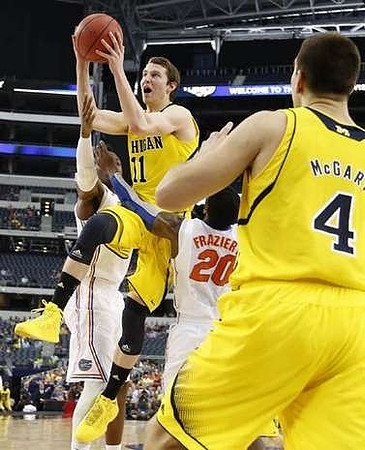 Trey Burke (3) and John Beilein