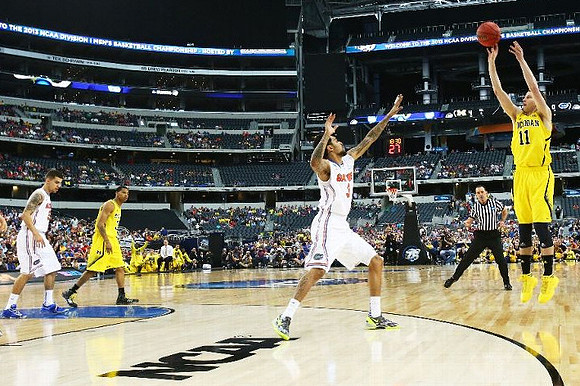 Trey Burke (3) and Nik Stauskas (11)