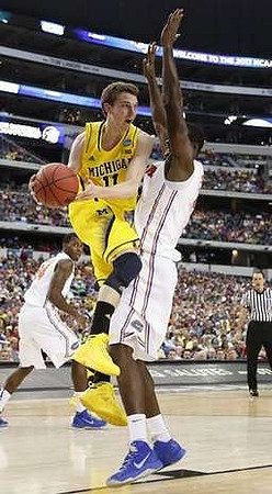 Glenn Robinson III (1) and Trey Burke (3)