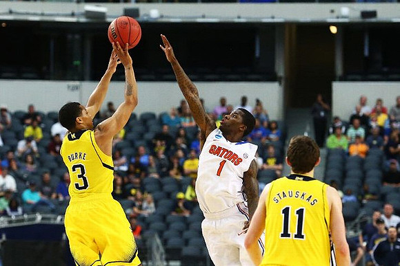 Trey Burke (3) and Nik Stauskas (11)