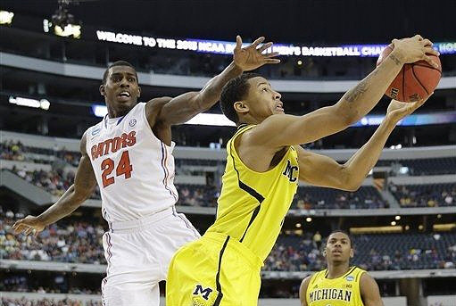 Trey Burke (3) and Glenn Robinson III (1)