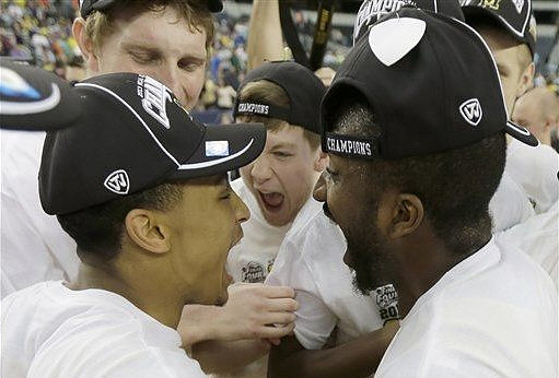 Trey Burke (3), Blake McLimans (22), Matt Vogrich (13), and Corey Person (32)