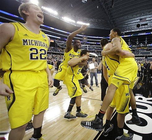 Blake McLimans (22), Jordan Morgan (52), Corey Person (32), Mitch McGary (4), and Trey Burke (3)