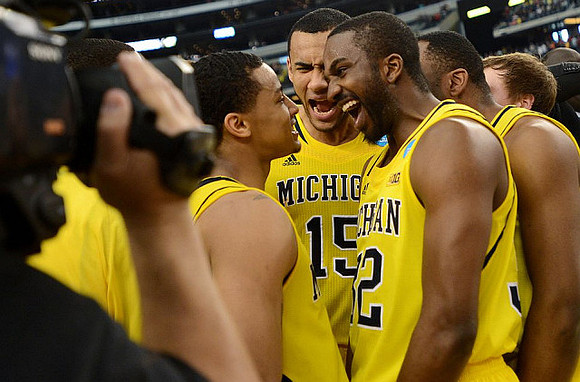 Trey Burke (3), Jon Horford (15), and Corey Person (32)