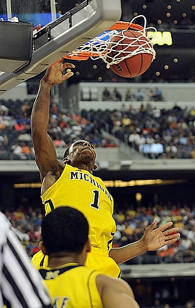 Nik Stauskas (11) and Mitch McGary (4)