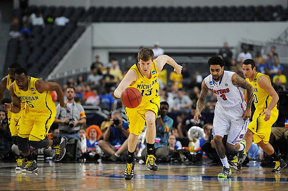 Corey Person (32), Eso Akunne (5), Matt Vogrich (13), and Josh Bartelstein (20)