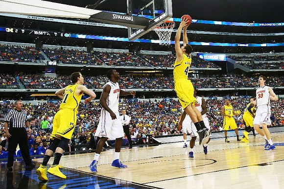 Nik Stauskas (11), Mitch McGary (4), Trey Burke (3), and Tim Hardaway Jr. (10)