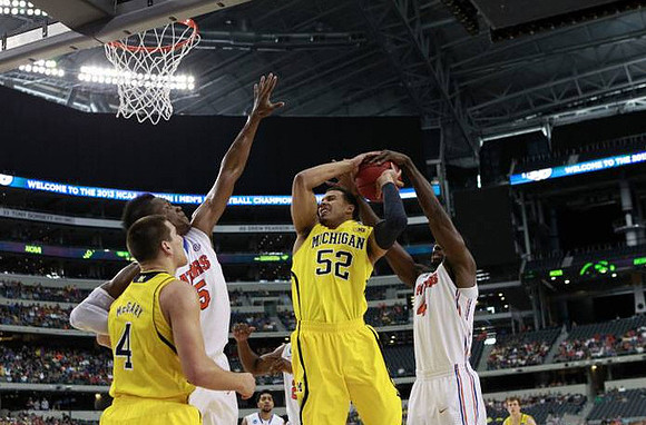 Mitch McGary (4) and Jordan Morgan (52)