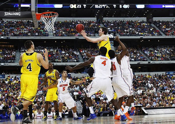 Mitch McGary (4), Glenn Robinson III (1), and Nik Stauskas (11)
