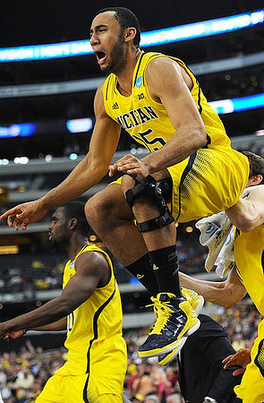 Tim Hardaway Jr. (10) and Jon Horford (15)