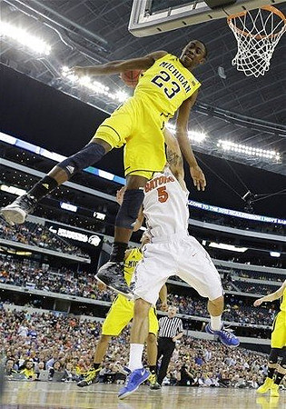 Caris LeVert (23) and Mitch McGary (4)