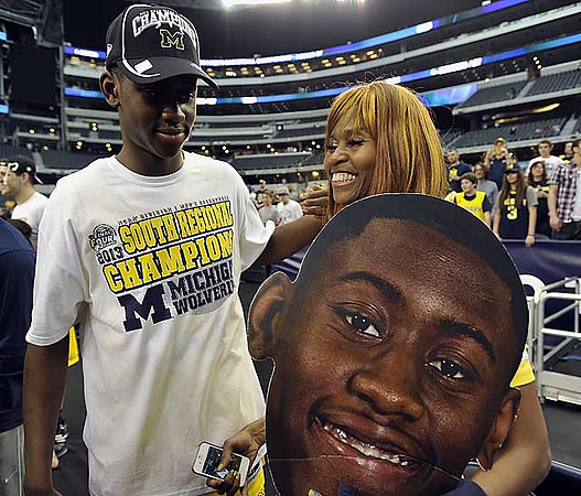 Corey Person (32), Tim Hardaway Jr. (10), and John Beilein