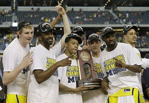Blake McLimans (22), Corey Person (32), Trey Burke (3), Josh Bartelstein (20), Tim Hardaway Jr. (10), and Jordan Morgan (52) with South Regional Championship Trophy