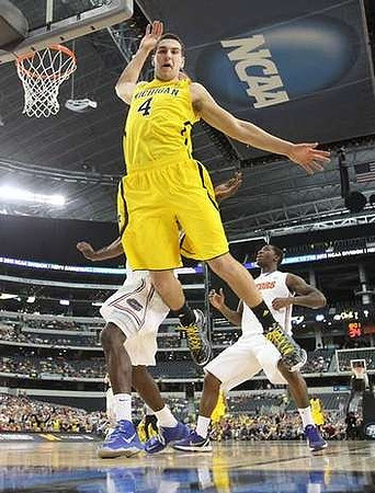 Nik Stauskas (11) and Spike Albrecht (2)