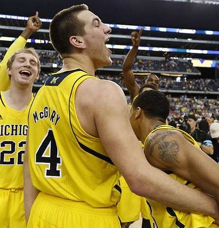Nik Stauskas (11), Mitch McGary (4), Caris LeVert (23), Glenn Robinson III (1), Glenn Robinson III (1), and Jon Horford (15)