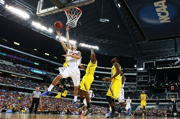 Nik Stauskas (11), Glenn Robinson III (1), Caris LeVert (23), and Jon Horford (15)