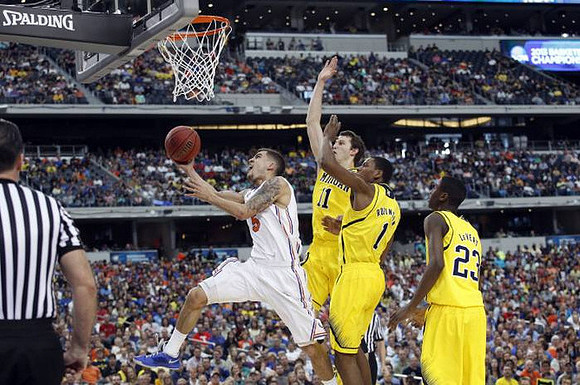 Nik Stauskas (11), Glenn Robinson III (1), and Caris LeVert (23)