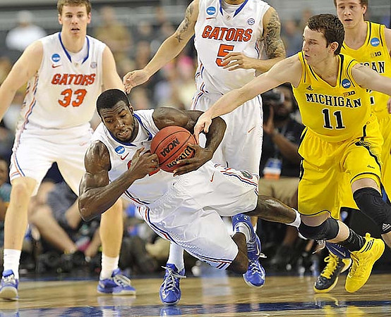 John Beilein, Jon Horford (15), Jeff Meyer, LaVall Jordan, Nik Stauskas (11), and Jordan Morgan (52)