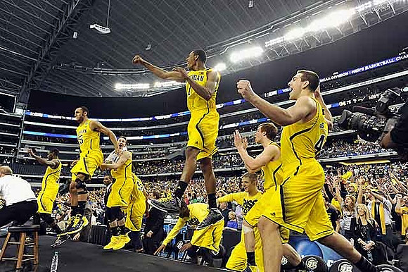 Blake McLimans (22), Jordan Morgan (52), and Trey Burke (3)