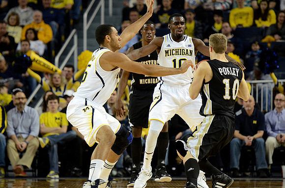 Jon Horford (15) and Tim Hardaway Jr. (10)