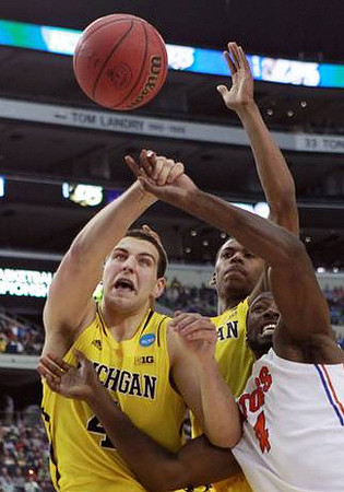 Mitch McGary (4) and Glenn Robinson III (1)