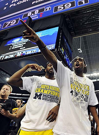 Mitch McGary (4) and Tim Hardaway Sr.