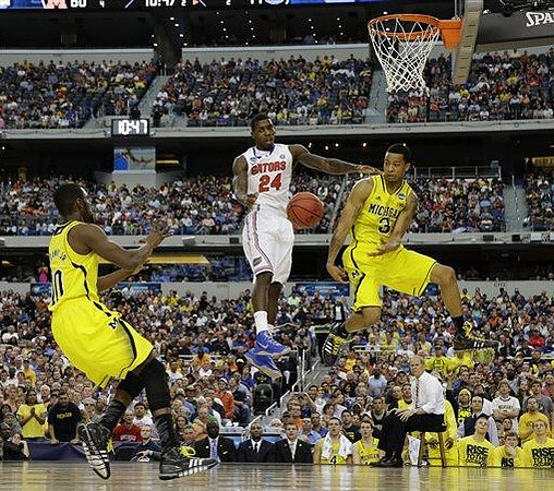 Tim Hardaway Jr. (10), Trey Burke (3), and John Beilein