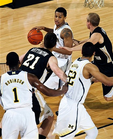 Trey Burke (3), Glenn Robinson III (1), and Jordan Morgan (52)