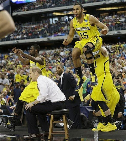 John Beilein, Tim Hardaway Jr. (10), LaVall Jordan, Jon Horford (15), and Nik Stauskas (11)