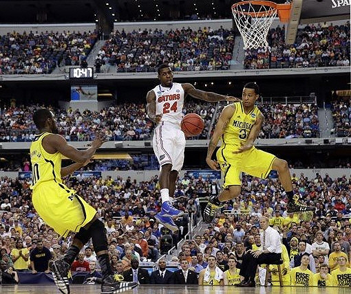 Tim Hardaway Jr. (10), Trey Burke (3), and John Beilein