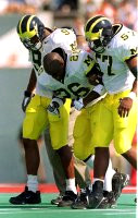 Eric Mayes (26), DiAllo Johnson (9), and Chris Singletary (57)