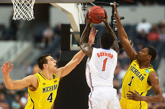 Mitch McGary (4) and Glenn Robinson III (1)