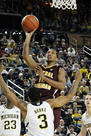 Caris LeVert (23), Trey Burke (3), and Nik Stauskas (11)