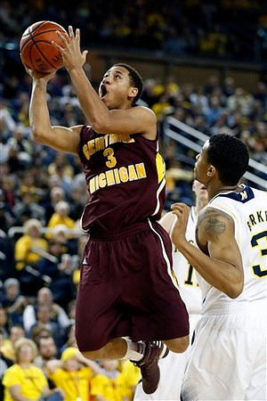 Trey Burke (3) and Nik Stauskas (11)