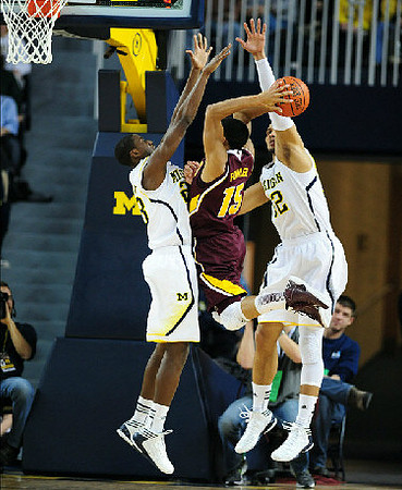 Caris LeVert (23) and Jordan Morgan (52)