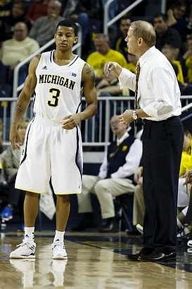 Trey Burke (3) and John Beilein