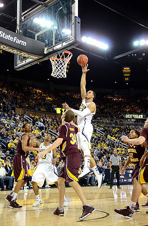 Jordan Morgan (52) and Trey Burke (3)