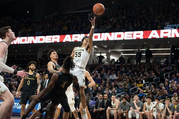 Eli Brooks (55) and Jon Teske (15)