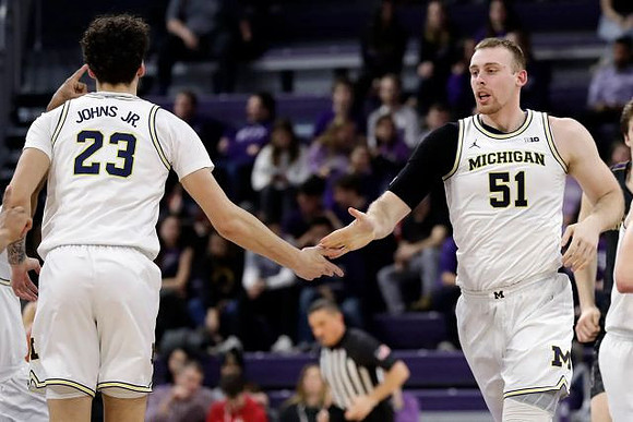 Brandon Johns Jr. (23) and Austin Davis (51)