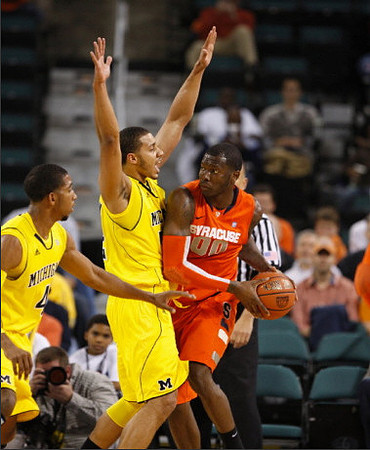 Darius Morris (4) and Jordan Morgan (52)