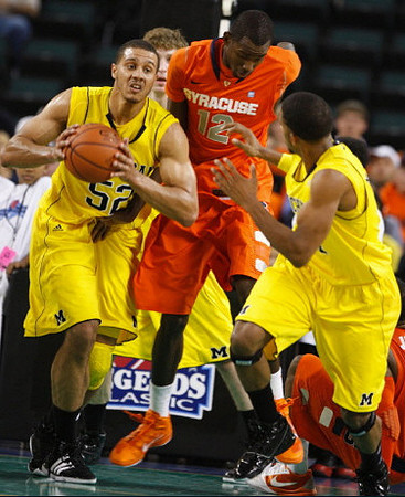 Jordan Morgan (52) and Darius Morris (4)