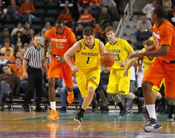 Stu Douglass (1), Evan Smotrycz (23), and Zack Novak (0)