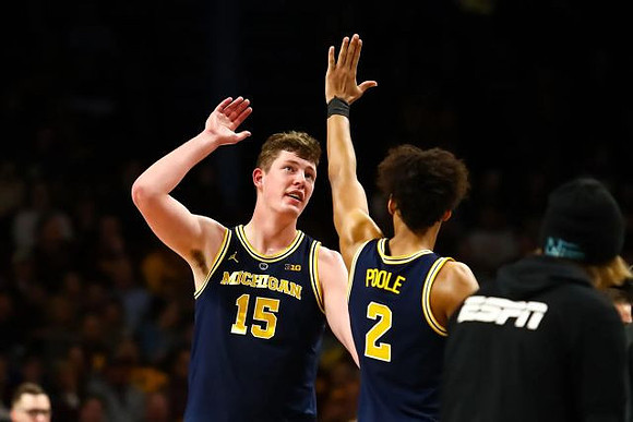 Jon Teske (15) and Jordan Poole (2)