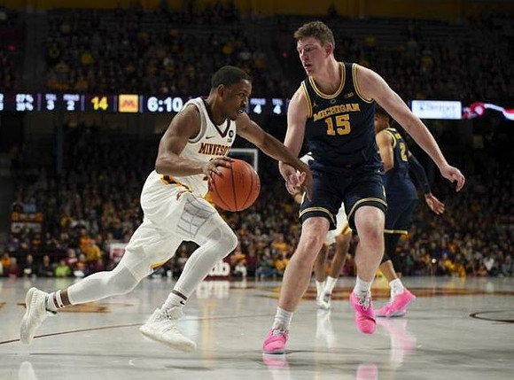 Jon Teske (15) and Jordan Poole (2)