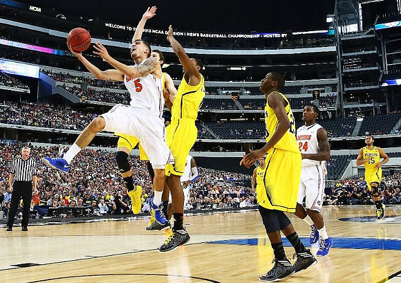 Nik Stauskas (11), Glenn Robinson III (1), Caris LeVert (23), and Jon Horford (15)