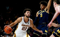 Jordan Poole (2) and Jon Teske (15)